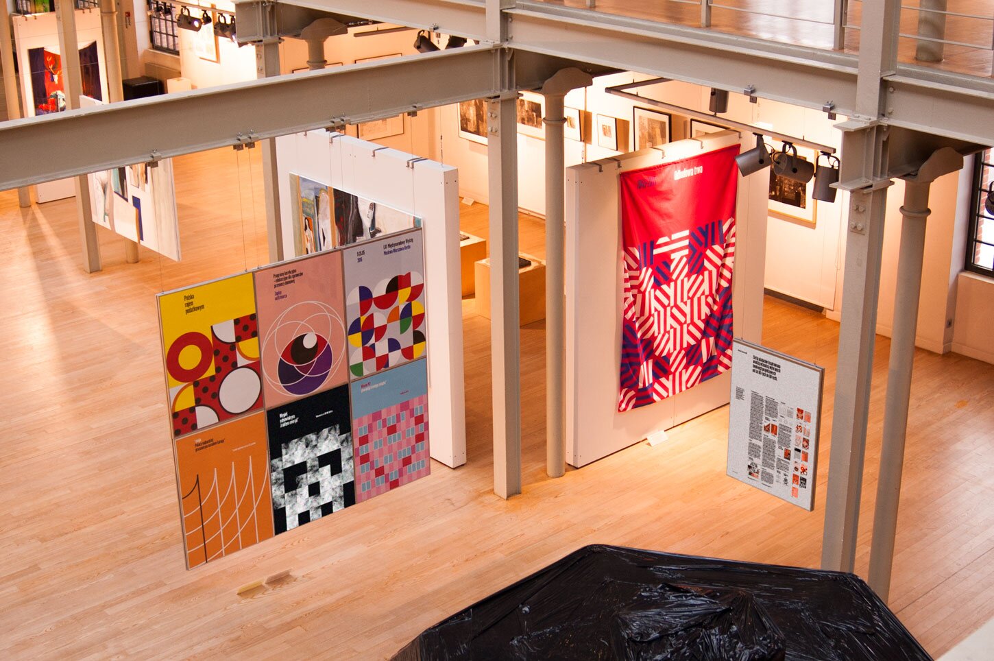 A photography of posters in an art gallery