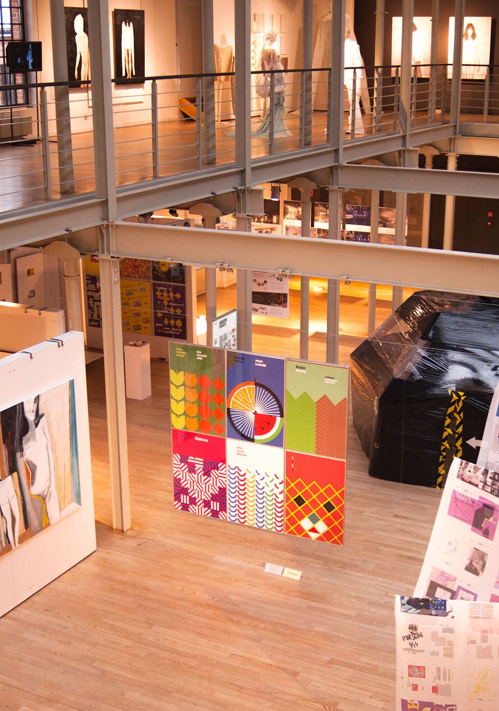 A photography of 6 posters in an art gallery