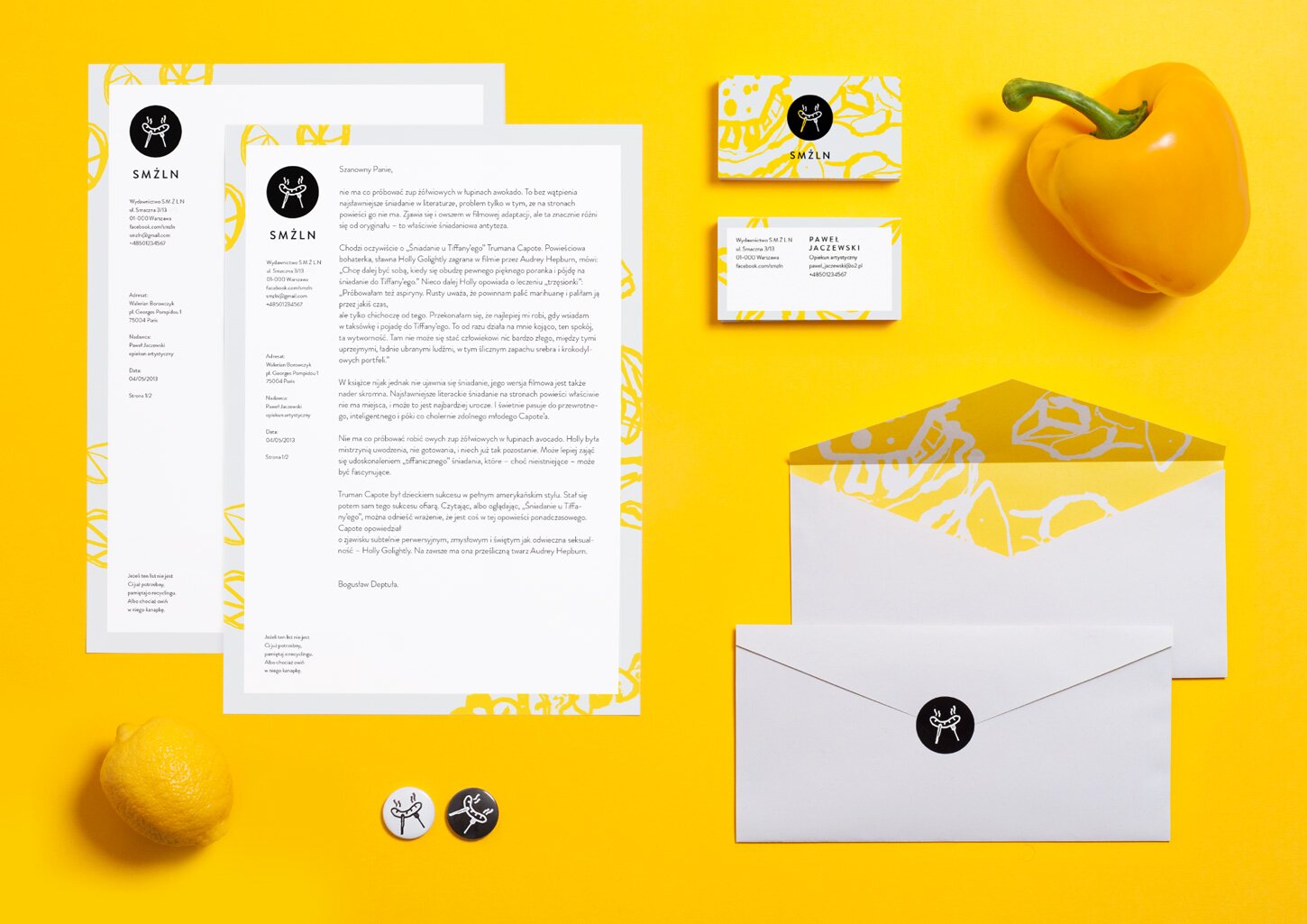 A photography of SMŻLN stationery: business cards, envelopes, letterheads