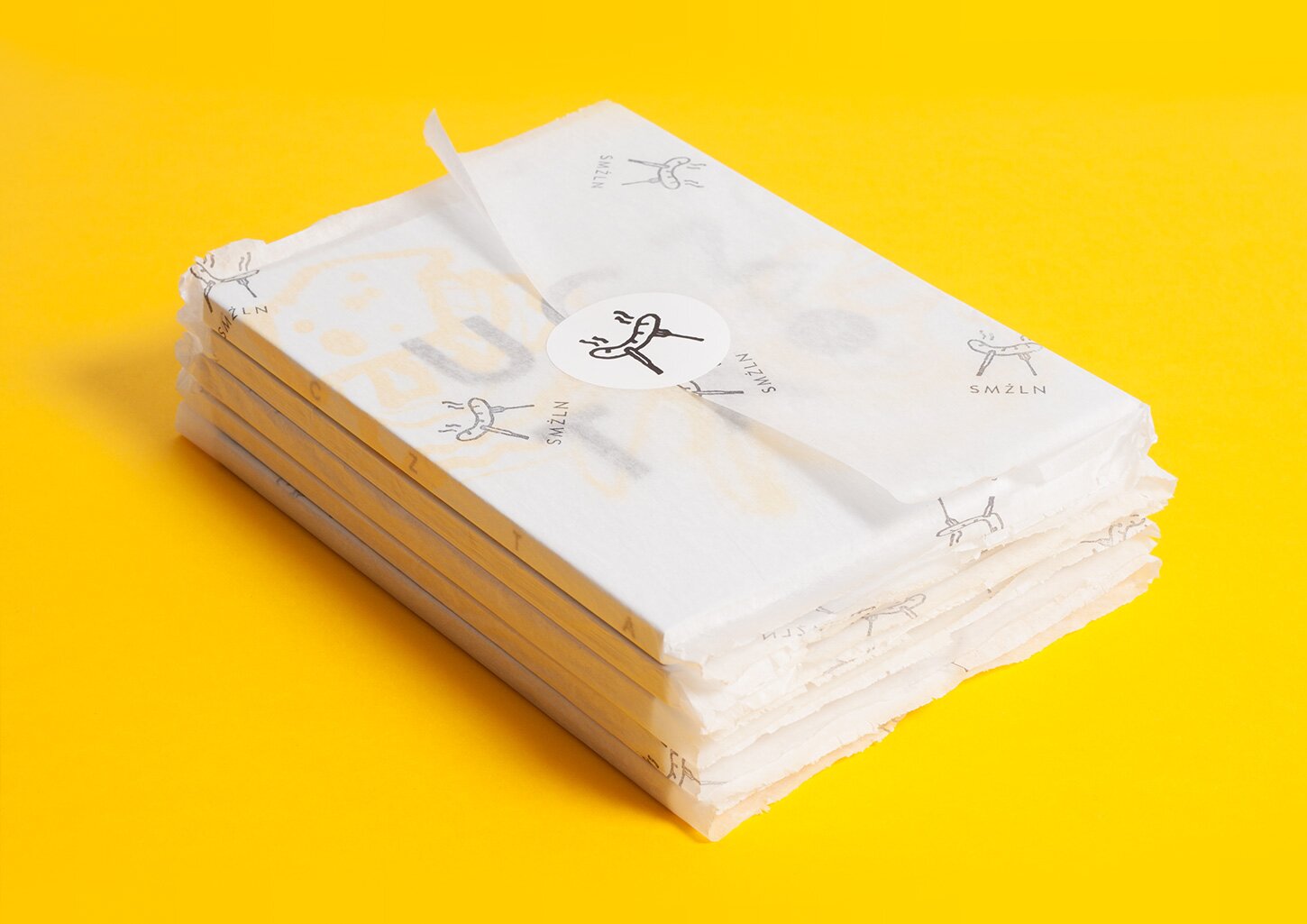 A photography of stack of UCZTA cookbooks