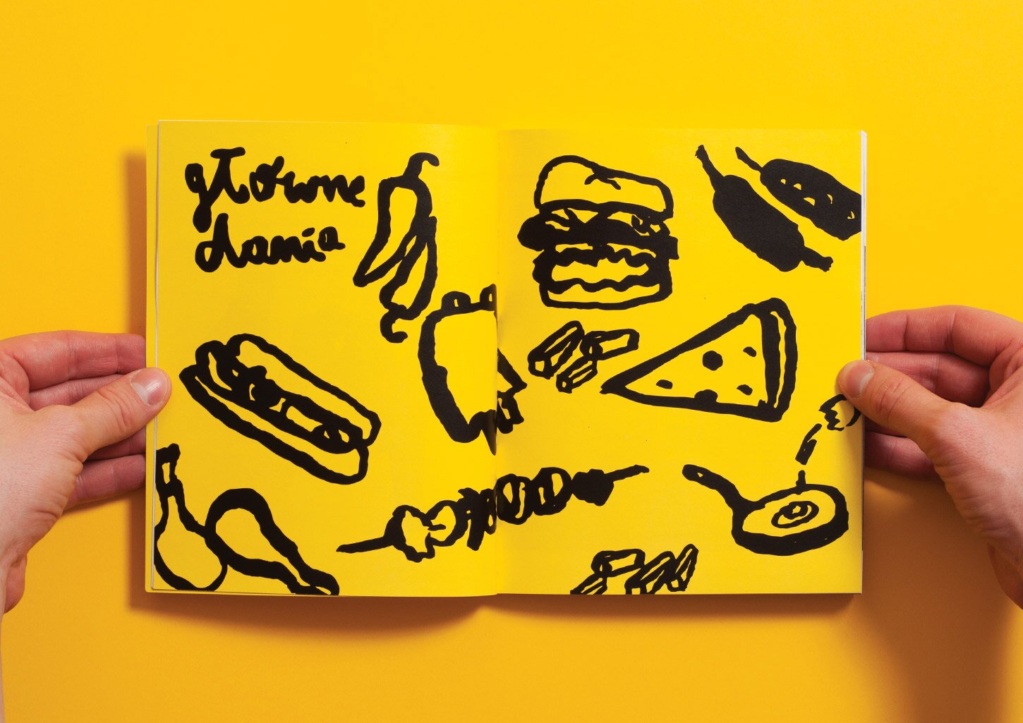 A spread from the UCZTA cookbook with an illustration of different food